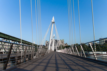Fototapeta na wymiar Low perspective of geometric bridge on a sunny day