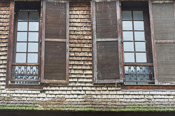 Windows of a wooden tenement house - old town in Troyes, France.