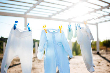 children's clothes on the clothesline on sunny day