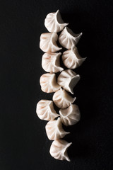 Chinese dumplings on black background