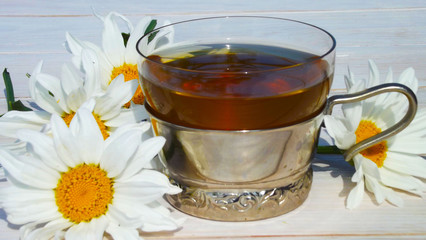 Healthy tea from chamomile flowers.