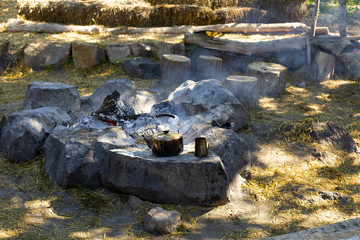 Cooking coffee on a fire. Make coffee or tea on the fire of nature. Burned fire. Place for the fire. Ash and coals and ash from the fire. 