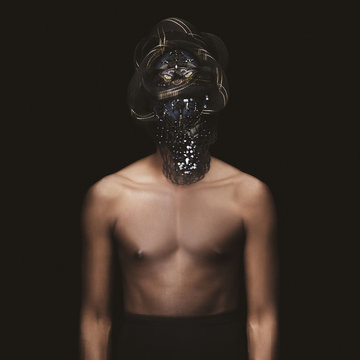 Portrait of shirtless man with mask