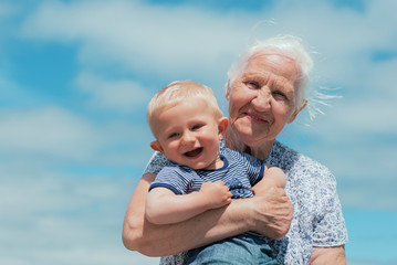 Elderly woman with a baby