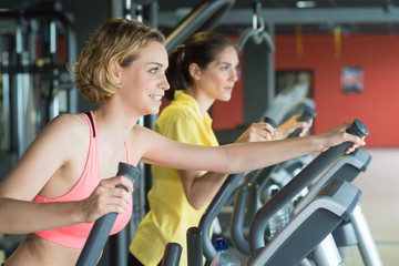 Fototapeta premium people training on machine in gym