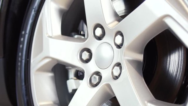 Car wheel on a car close-up. Stock. Wheel tuning disk. Car wheel close-up