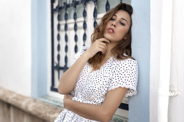 .Thoughtful girl next to a window