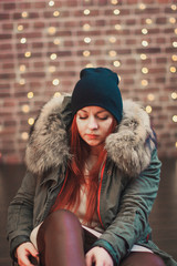 cool beautiful red-haired girl in the hat