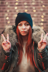 cool beautiful red-haired girl in the hat