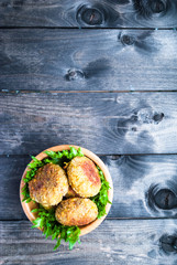 Fried chickpea falafel and leaves of green salad