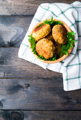 Fried chickpea falafel and leaves of green salad