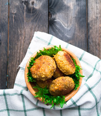 Fried chickpea falafel and leaves of green salad
