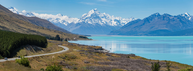 Panoramic view of Mount Cook mountain range with the beautiful turquoise waters of Lake Pukaki,...