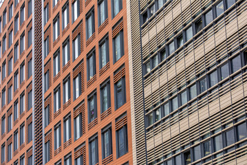Fototapeta na wymiar Windows of multi-storey office building.