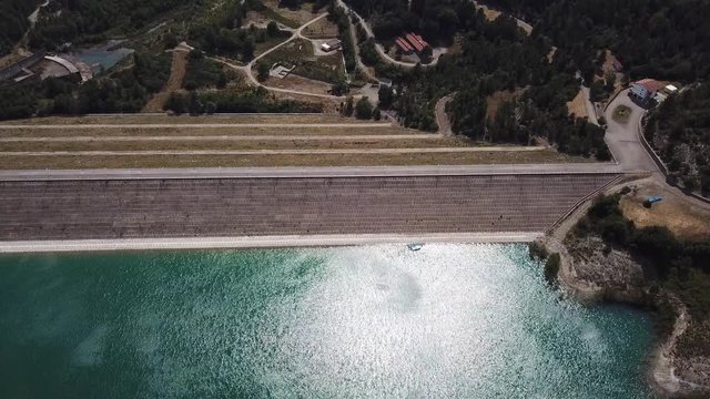 Up and down aerial view of the dam of the lake Montedoglio an artificial lake, one of the biggest in Europe. Tuscany. Italy