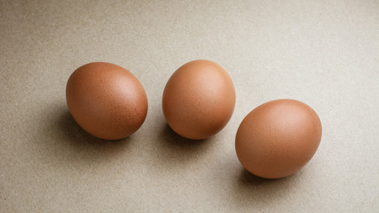 Brown chicken eggs on recycled craft paper