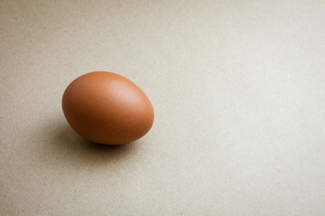 Brown chicken eggs on recycled craft paper