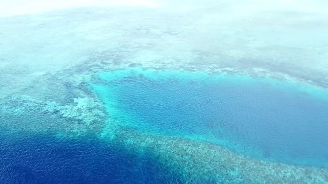 Aerial of Coral Reef and Blue Hole in Indonesia
