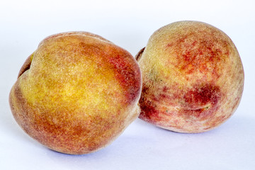 Peaches on the white background