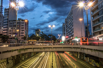 Fototapeta na wymiar Sao Paulo, Brazil, November 16, 2017. People and traffic jam on Paulista Avenue, in Sao Paulo