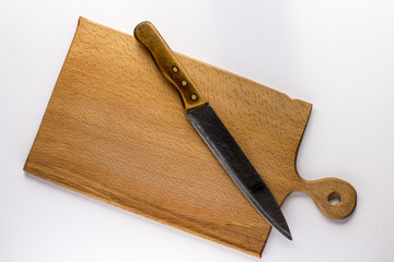Kitchen wooden board with knife on white background