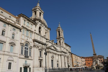 Fototapeta na wymiar Santa Agnese in Agone and Fontana dei Quattro Fiumi at Piazza Navona in Rome, Italy 