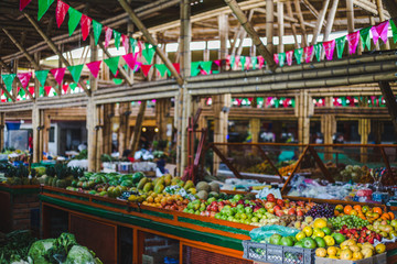 Colorful food market with red and green bunting in Cali, Colombia