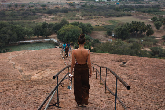 Woman walking down pathway