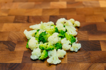 Broken into pieces broccoli and cauliflower
