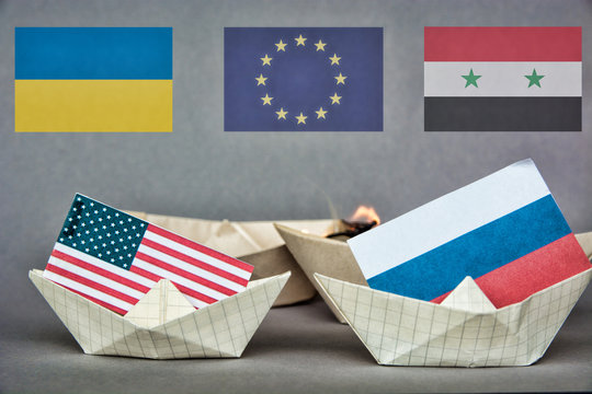 paper ship with Flags of USA and Russia. conflict  concept shipment or free trade agreement and membership. grunge image 