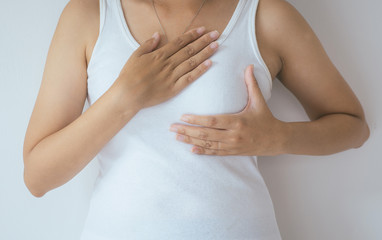 Awareness healthy lifestyle concept,Breast cancer symbol,Woman hand touching her chest