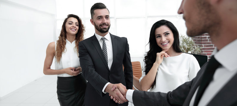 handshake of business people on the background of the office