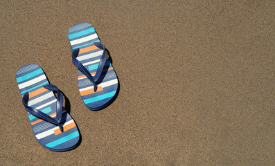 blue slippers on the beach  on the sand