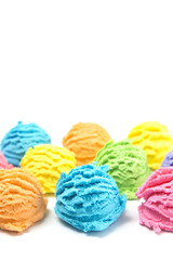 Scoops of Rainbow Ice Cream on a White Table