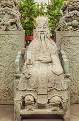 Statues at Wat Arun monumental Buddhist temple in Bangkok, Thailand.