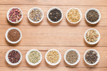 White bowls with different herbs for infusion.