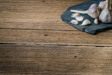 Garlic on black stone plate
