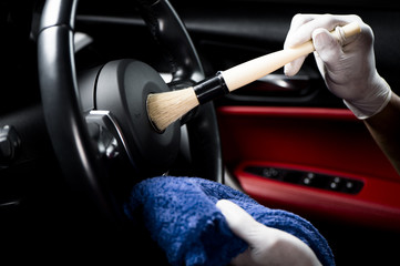 Cleaning car interior.