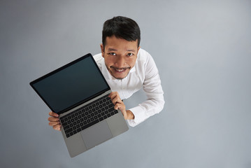 Young asian man with laptop