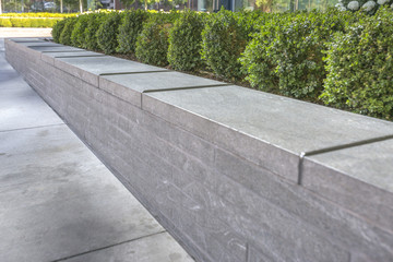 Metal gaurds on the edge of concrete planter