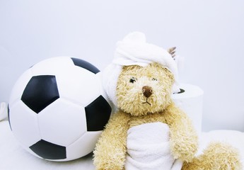 Bear is in toilet with football .
