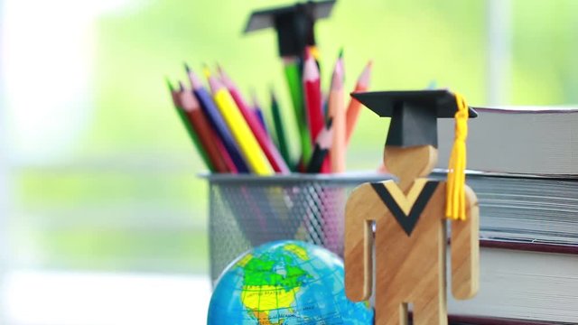 America Education knowledge learning study abroad international Ideas. People Sign wood with Graduation celebrating cap on open textbook with model global map, alternative studying world wide