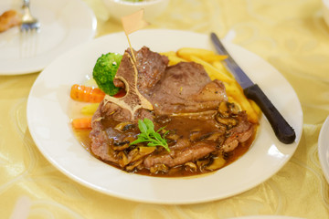 Beef steak in the plate on the table of Soft Focus