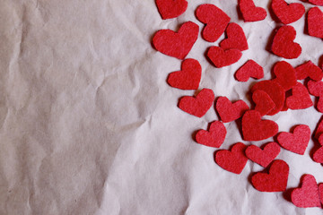 Red paper hearts shape on brown crumpled paper background, Top view.Valentine's day holiday concept. Copy space