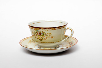 A porcelain tea cup in a saucer