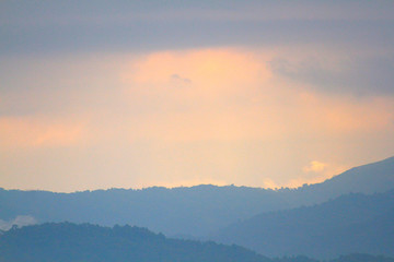 Beautiful landscape natural light in the morning fog on the mountain and the sunrise shining to the mist in forest northern of Thailand.