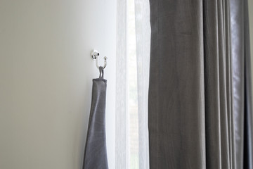 curtain and silver hook and white wall house