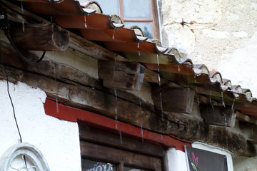 raindrops falling from a roof in Saint-Cirq-Lapopie, France