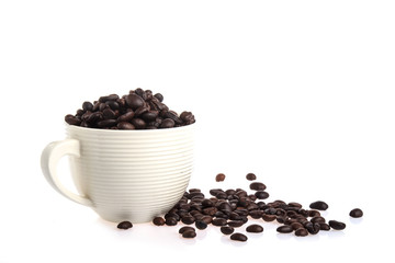 Coffee cup and beans on white background.