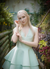 Fototapeta premium Summertime portrait of beautiful young woman. Selective focus.